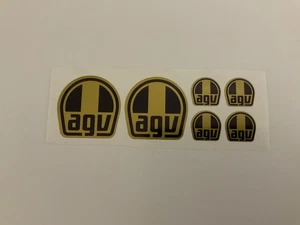 Calcomanías precortadas AGV negras sobre doradas 2x 43 mm x 43 mm y 4x 20 mm x 20 mm. Moto GP, WSBK - Imagen 1 de 5