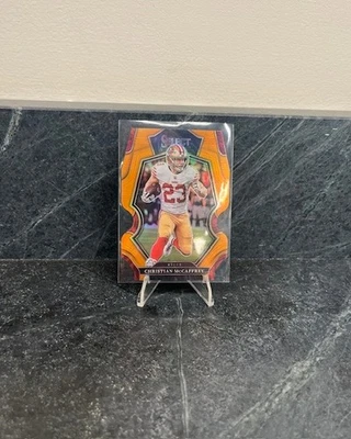 2022 Panini Select - #186 Christian McCaffrey Orange Die-Cut Premier Level /199 - Image 1 of 2