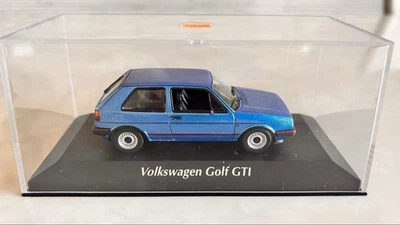 Minichamps 1/43 Volkswagen Golf GTI 1985 blu metallizzato pressofuso... - Immagine 1 di 4