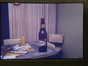 Lot of 2 Genesee Beer Bottles April 1970 35mm Slides Displayed on Old Table - Picture 1 of 5