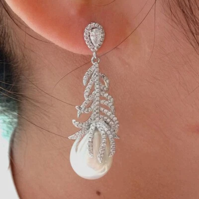 White Teardrop Sea Shell Pearl Gold Plated Cz Pave Feather Stud Earrings - Image 1 of 4