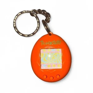 Vintage Tamagotchi P2 Virtual Pet Orange mit Grün 1997 - Bild 1 von 2