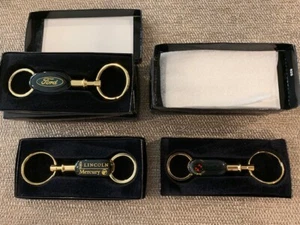 Lot of 7 Assorted key fob - Cadillac, Ford, and Mercury Lincoln - Bild 1 von 3