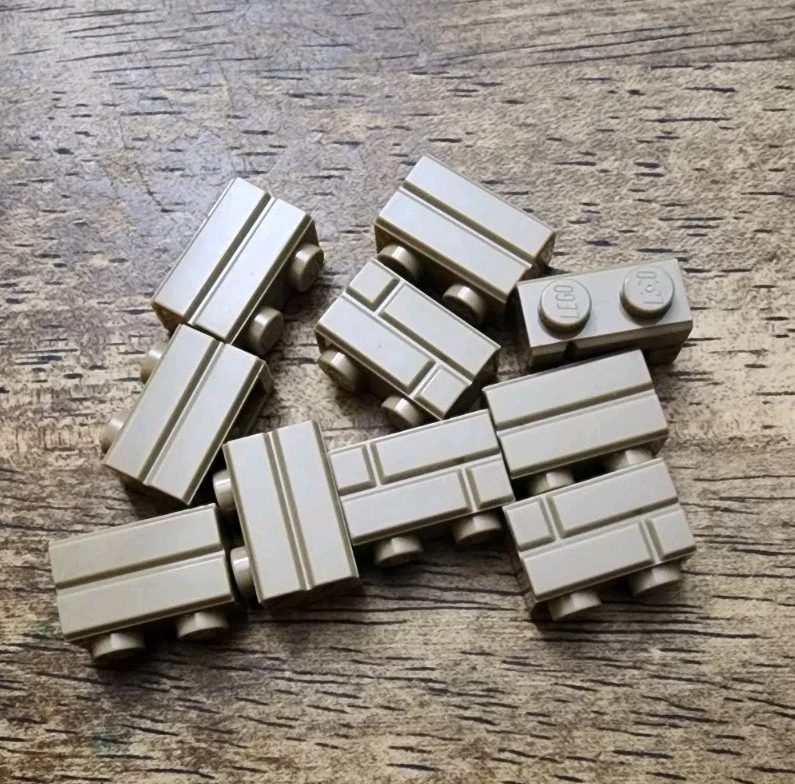 LEGO Ladrillo Bronceado Oscuro, Modificado 1 x 2 con Perfil de Albañilería CANTIDAD 10. 98283. Foto 1 de 1