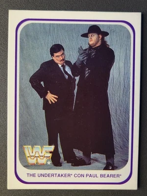 1991 Merlin WWF Italian Trading Card #136 UNDERTAKER & PAUL BEARER ROOKIE (RC) - Image 1 of 2