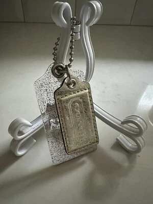 Coach TWO Hang Tags In Clear Red And Blue Specs Plastic And Gold - Image 1 of 4