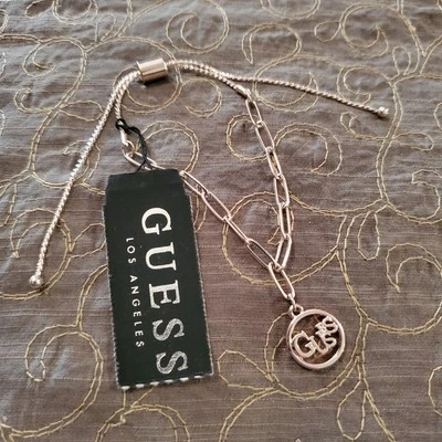 Pulsera de eslabones Guess ajustable tono dorado con dije nueva con etiquetas Foto 1 de 4