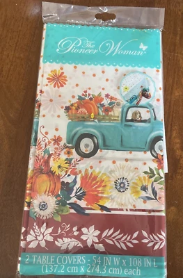 The Pioneer Woman 2 fundas de mesa de plástico primavera/otoño florales para perros y camiones azules Foto 1 de 4