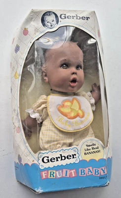 MUÑECA BEBÉ TOY BIZ GERBER FRUIT NEGRA VINTAGE 1996 PERFUMADA PLÁTANO NUEVA EN CAJA Foto 1 de 4