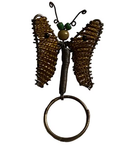 Portachiavi farfalla oro arte filo perline africano vintage fatto a mano in Madagascar - Foto 1 di 5