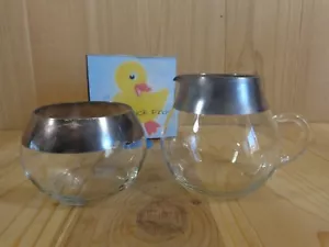 CONJUNTO DE LLANTAS ENCHAPADAS EN PLATA DE VIDRIO TRANSPARENTE CREMA Y AZÚCAR - Imagen 1 de 2