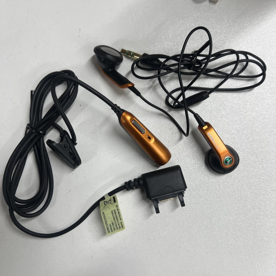Sony Ericsson HPM-64 Headphones for K660i K750i K770i K800i K850i black&orange - Image 1 of 3