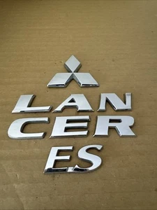 🟦FREE SHIPPING OEM 2002 2003 Mitsubishi Lancer ES Emblem Badge Set - Picture 1 of 5