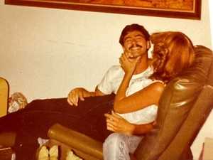 GE Photo Cute Couple Smile Recliner Chair 1970's Pretty Mystery Woman Handsome - Picture 1 of 3