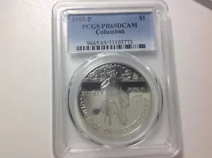 1992-P $1.00 Columbus PCGS PR69DCAM (yellow) - Picture 1 of 2