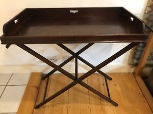 Elegant antique mahogany butlers tray and stand.