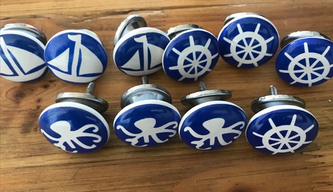 10- Blue nautical themed knobs on white ceramic Cover