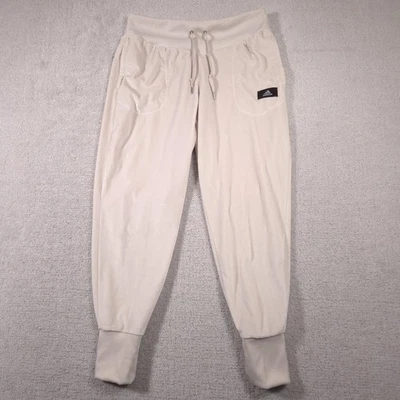 Calça jogger Adidas feminina grande bege veludo com nervuras cintura bolsos algemados HC8888 - Imagem 1 de 4