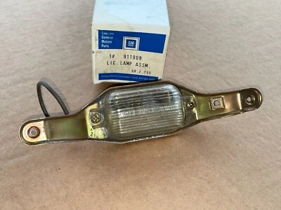 Corvette rear license plate light lamp assembly GM NOS NEW 72 73 - Image 1 of 4