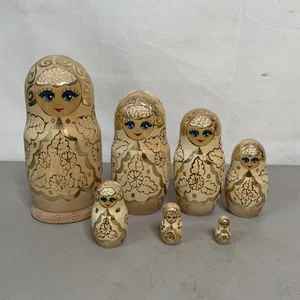 Russian Matryoshka 7 Piece Set Signed 8.5” Tall Tan Natural Gold Accents - Picture 1 of 11