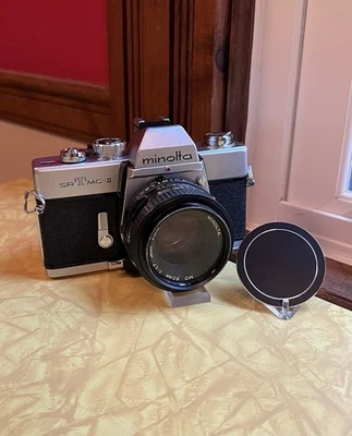 Cámara réflex de película Minolta SRT MC II 35 mm + lente Minolta MD 50 mm 1,7 + filtro y tapa Foto 1 de 4