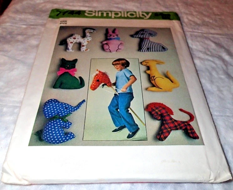 VINTAGE SIMPLICITY PATTERN 7744 ~ 7 STUFFED ANIMALS & HOBBY HORSE *UNCUT - Image 1 of 1