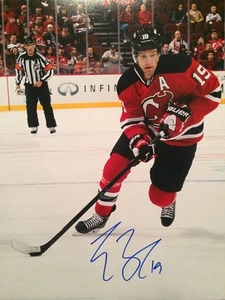 TRAVIS ZAJAC SIGNED 11x14 NEW JERSEY DEVILS STAR AUTOGRAPH - Picture 1 of 1