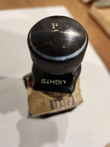 Corvette C-3  1982 headlight switch with bezel and knob good  graphics on bezel - Picture 1 of 3