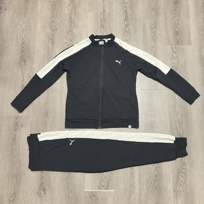 Chaqueta y pantalones deportivos Puma para hombre negros con rayas blancas Foto 1 de 4