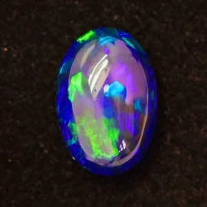 4.72cts 15x10mm Ov Rolling Flash Patern Rainbow Color Play Ethiopian Black Opal - Picture 1 of 4