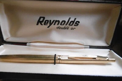 Stylo bille Reynolds ancien doublé or poinçonné dans son écrin. En très bon état - Photo 1/4