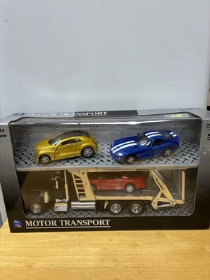 NEWRAY Peterbilt  Motor Transport CARRIER W/ DODGE PROWLER PT CRUISER VIPER 1/32 - Image 1 of 4