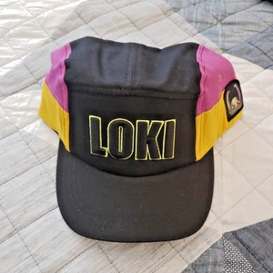 New Disney Parks LOKI Pink, Yellow, & Black Snap Back Baseball Hat Cap Adult - Picture 1 of 3