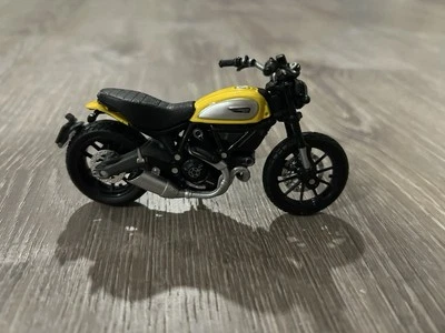 SUELTO 2022 MAISTO 2 RUEDAS ESCALA 1:18 AMARILLO DUCATI SCRAMBLER ICONO Foto 1 de 4