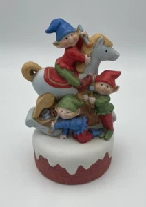 Porcelain Elf Riding On Rocking Horse With Two Elf Workers Working Music Box - Picture 1 of 8