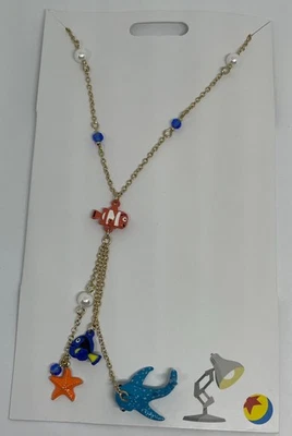 Collar con dije colgante de Dory Nemo para encontrar joyas de los parques de Disney nuevo con tarjeta Foto 1 de 3