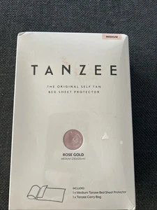 Protector de sábana y bolsa de transporte Tanzee oro rosa autobronceado mediano nuevo sellado - Imagen 1 de 6