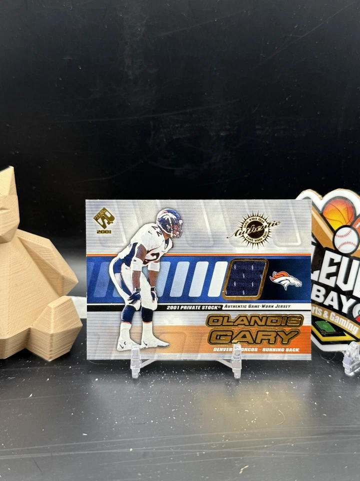 Olandis Gary 2001 Pacific Private Stock Game Worn Gear Patch (JMR) - Image 1 of 2