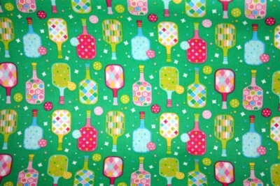 COLORFUL PICKLEBALL RACQUETS AND BALLS ON GREEN - 100% COTTON FABRIC - Image 1 of 3