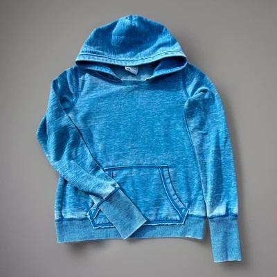 Sudadera con capucha Zen by J America para mujer azul lavado pequeño pulóver polar bolsillo frontal Foto 1 de 4