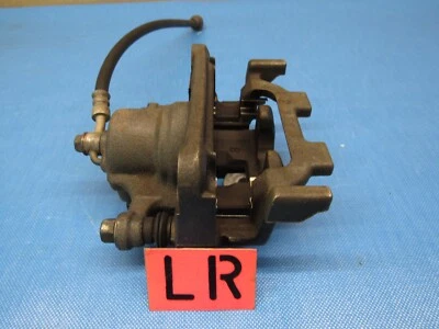 Pinza de freno trasera izquierda Infiniti Q50 2014-2021 OEM Foto 1 de 4