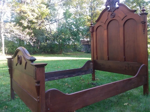 Antique victorian neo gothic bed frame.  It takes a 3/4 mattress which is 48 x75 Cover