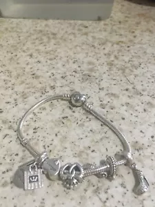 ii selling 2 pandora bracelets 1 got all the charms Ii with couple charms on it  - Picture 1 of 6