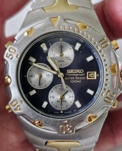 %Vtg Seiko Chronograph Mens Watch 7T32-6M49 Blue Gold Silver Tone 100M Sold Asis - Picture 1 of 4