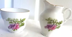 Juego de crema/azúcar Schumann Arzberg lila floral sobre blanco Baviera Alemania-DE COLECCIÓN - Imagen 1 de 7