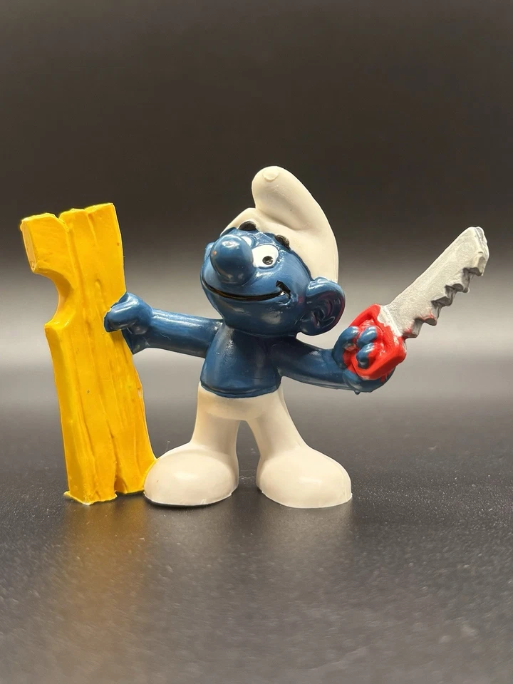 (B) Figura PVC de colección 1978 Schleich pitufo carpintero con sierra y madera Hong Kong Foto 1 de 4