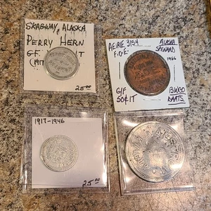 Raro lotto di 4 gettoni commerciali Alaska Kwiguk, Aeirie 3154 F.O.E, SKAGWAY, (Y8) - Foto 1 di 9