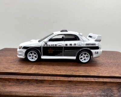 CUSTOM MATCHBOX SUBARU IMPREZA POLICE MBX JAPAN CRUISERS SERIES - REAL RIDERS - Image 1 of 4