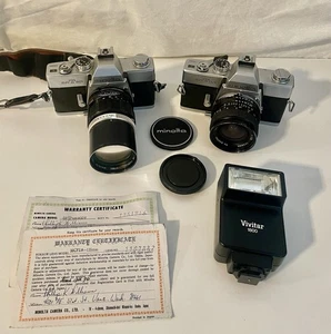 2 fotocamere MINOLTA SRT201 35mm con 2 obiettivi, flash e cinghia - così come sono, solo parti - Foto 1 di 17