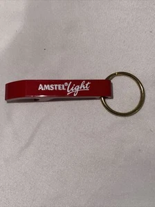 Llavero vintage de metal Amstel rojo claro abridor de botellas anuncio de cerveza - Imagen 1 de 10